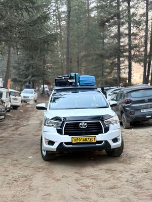 A happy traveler taking a photo in the mountains.